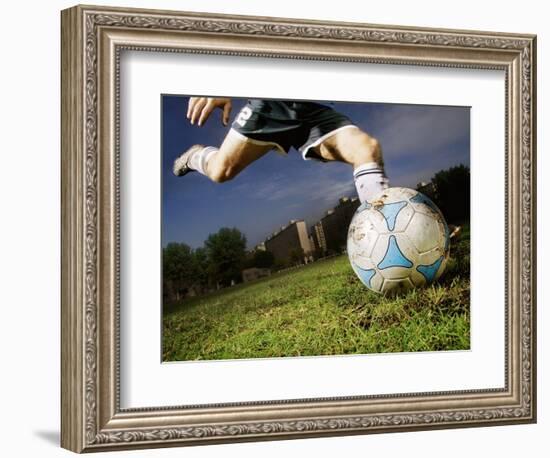 Soccer Player Kicking Ball-Randy Faris-Framed Photographic Print