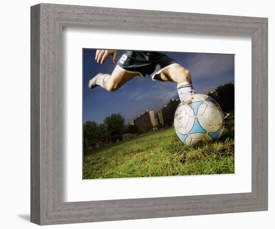 Soccer Player Kicking Ball-Randy Faris-Framed Photographic Print