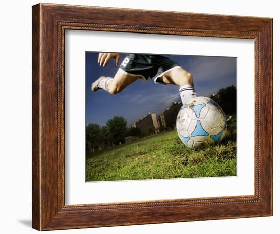 Soccer Player Kicking Ball-Randy Faris-Framed Photographic Print