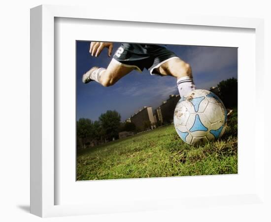 Soccer Player Kicking Ball-Randy Faris-Framed Photographic Print