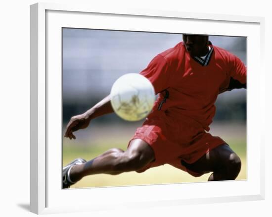 Soccer Player Preparing to Kick Ball-null-Framed Photographic Print