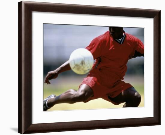 Soccer Player Preparing to Kick Ball-null-Framed Photographic Print