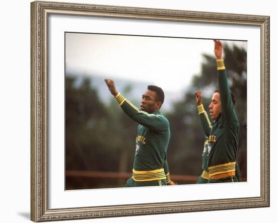 Soccer Star Pele and Teammates Loosen Up before a Practice Prior to World Cup Competition-null-Framed Premium Photographic Print