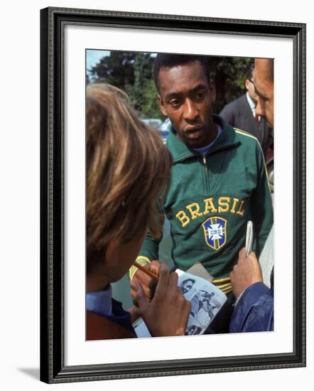 Soccer Star Pele Signing Autographs for Fans During a Practice Prior to World Cup Competition-null-Framed Premium Photographic Print