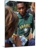 Soccer Star Pele Signing Autographs for Fans During a Practice Prior to World Cup Competition-null-Mounted Premium Photographic Print