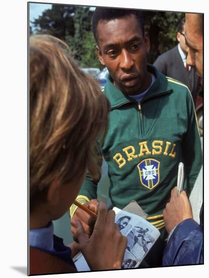 Soccer Star Pele Signing Autographs for Fans During a Practice Prior to World Cup Competition-null-Mounted Premium Photographic Print