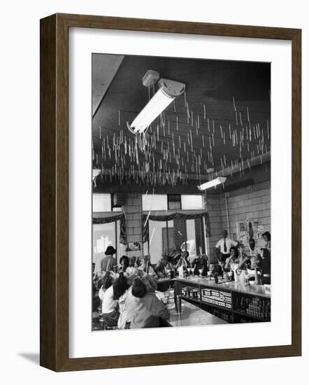 Soda Fountain Proprietor Watching as Kids Use Drinking Straw Covers as Straw Blowgun Missiles-Wallace Kirkland-Framed Photographic Print