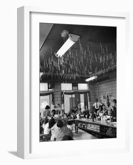 Soda Fountain Proprietor Watching as Kids Use Drinking Straw Covers as Straw Blowgun Missiles-Wallace Kirkland-Framed Photographic Print