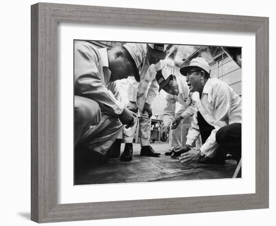 Soichiro Honda Showing Engineers Solution to Body Noise Problem at Research Facility, Japan, 1967-Takeyoshi Tanuma-Framed Photographic Print