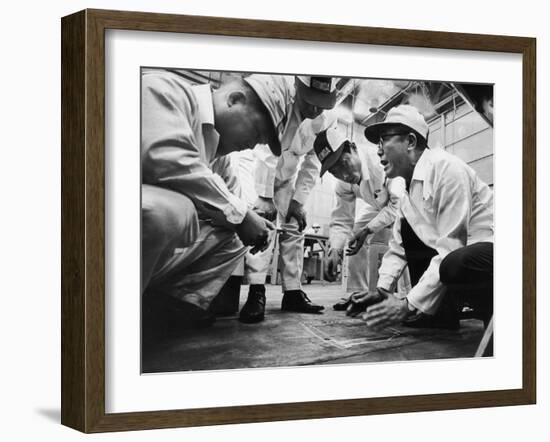 Soichiro Honda Showing Engineers Solution to Body Noise Problem at Research Facility, Japan, 1967-Takeyoshi Tanuma-Framed Photographic Print