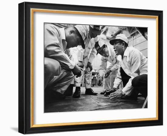 Soichiro Honda Showing Engineers Solution to Body Noise Problem at Research Facility, Japan, 1967-Takeyoshi Tanuma-Framed Photographic Print