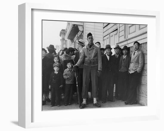 Soldier Standing Guard of Japanese American Citizens Awaiting Transport to Relocation Camps-Dorothea Lange-Framed Photographic Print