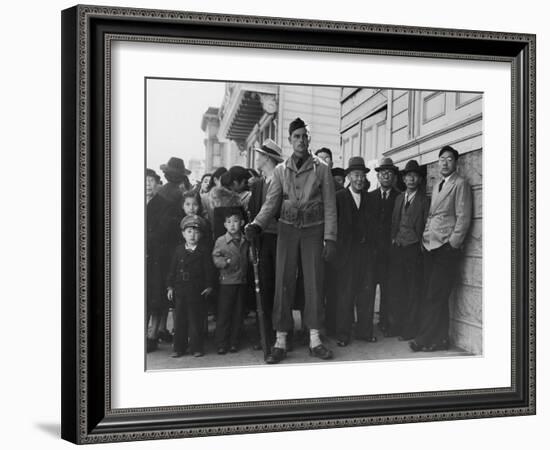 Soldier Standing Guard of Japanese American Citizens Awaiting Transport to Relocation Camps-Dorothea Lange-Framed Photographic Print