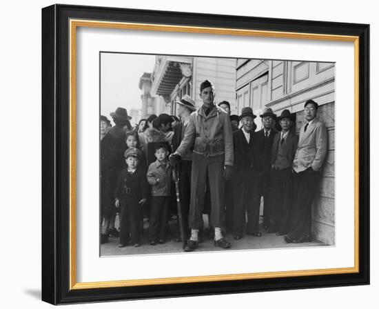 Soldier Standing Guard of Japanese American Citizens Awaiting Transport to Relocation Camps-Dorothea Lange-Framed Photographic Print