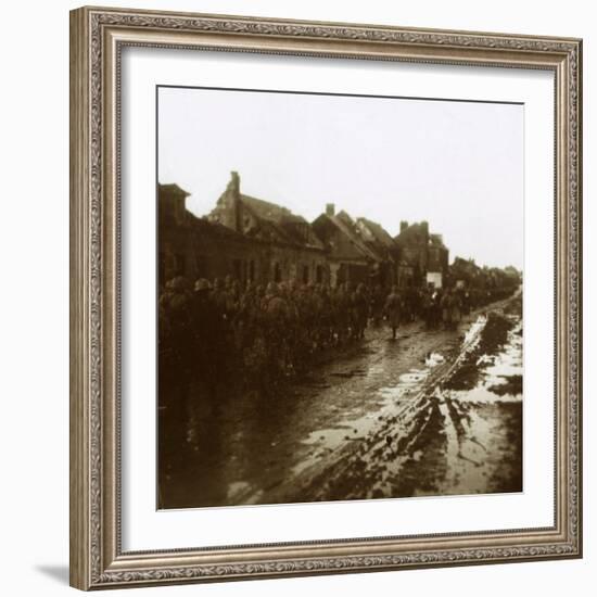 Soldiers marching past bombed-out houses, Champagne, northern France, c1914-c1918-Unknown-Framed Photographic Print