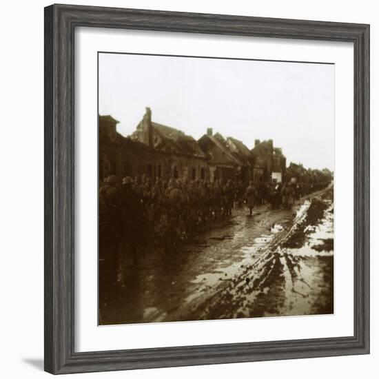 Soldiers marching past bombed-out houses, Champagne, northern France, c1914-c1918-Unknown-Framed Photographic Print