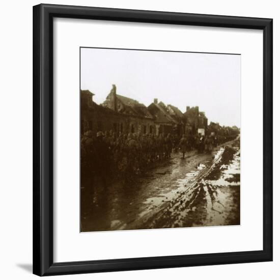 Soldiers marching past bombed-out houses, Champagne, northern France, c1914-c1918-Unknown-Framed Photographic Print