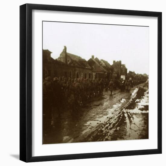 Soldiers marching past bombed-out houses, Champagne, northern France, c1914-c1918-Unknown-Framed Photographic Print