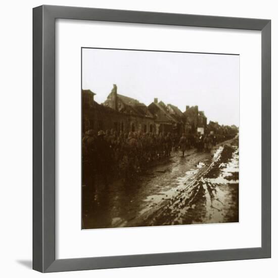 Soldiers marching past bombed-out houses, Champagne, northern France, c1914-c1918-Unknown-Framed Photographic Print