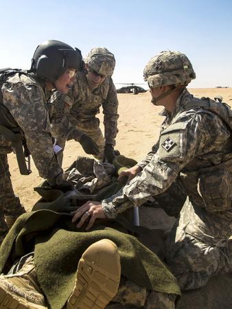 Soldiers Prepare To Load A Wounded Soldier Onto A Uh 60 Black Hawk Photographic Print Art Com