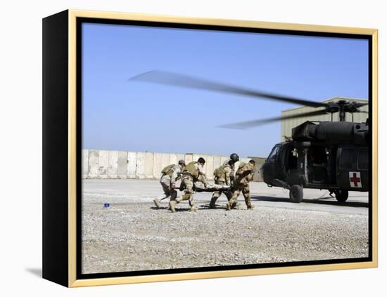 Soldiers Rush a Simulated Casualty to a UH-60 Blackhawk Helicopter-Stocktrek Images-Framed Premier Image Canvas