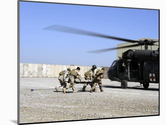 Soldiers Rush a Simulated Casualty to a UH-60 Blackhawk Helicopter-Stocktrek Images-Mounted Photographic Print