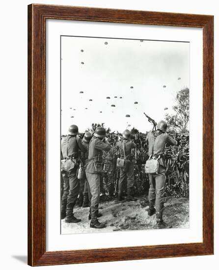 Soldiers Shooting at Enemy Parachuting into Field-null-Framed Photo