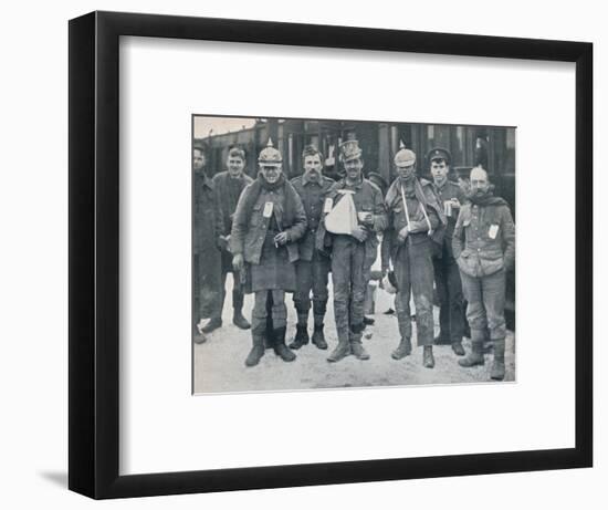 Some cheerful wounded from the Neuve Chapelle fighting, wearing captured German helmets, 1915-Unknown-Framed Photographic Print