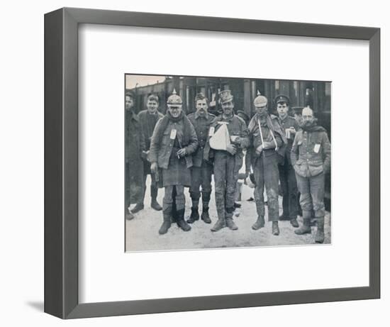 Some cheerful wounded from the Neuve Chapelle fighting, wearing captured German helmets, 1915-Unknown-Framed Photographic Print