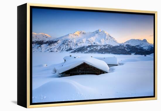 Some Scattered Huts in a Snowy Landscape at Spluga by the Maloja Pass with Magical Sunset Colors-Roberto Moiola-Framed Premier Image Canvas