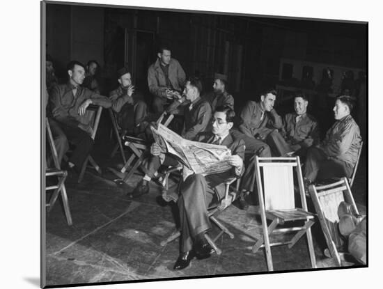 Songwriter Irving Berlin Reading Newspaper as Others Sit around Talking-null-Mounted Photographic Print