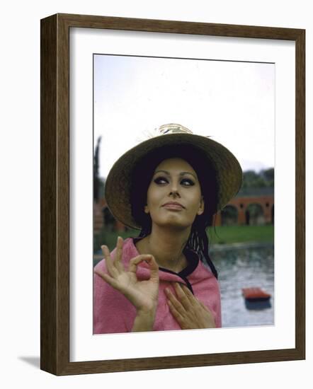 Sophia Loren Wearing a Pink Wrap and Straw Hat Out by the Pool at the Villa-Alfred Eisenstaedt-Framed Premium Photographic Print