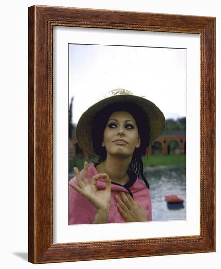 Sophia Loren Wearing a Pink Wrap and Straw Hat Out by the Pool at the Villa-Alfred Eisenstaedt-Framed Premium Photographic Print