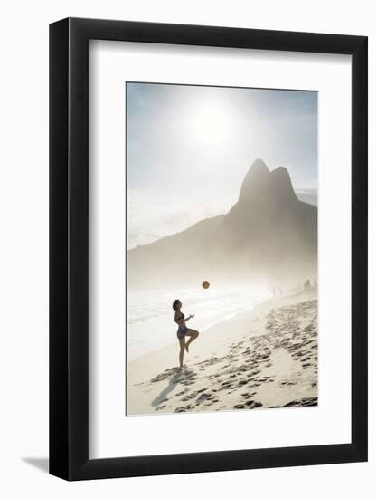 South America, Brazil, Rio de Janeiro, a woman practising football or altinha on Ipanema beach (MR)-Alex Robinson-Framed Photographic Print