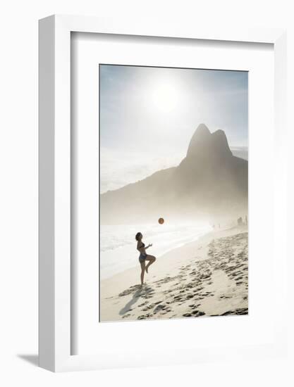 South America, Brazil, Rio de Janeiro, a woman practising football or altinha on Ipanema beach (MR)-Alex Robinson-Framed Photographic Print