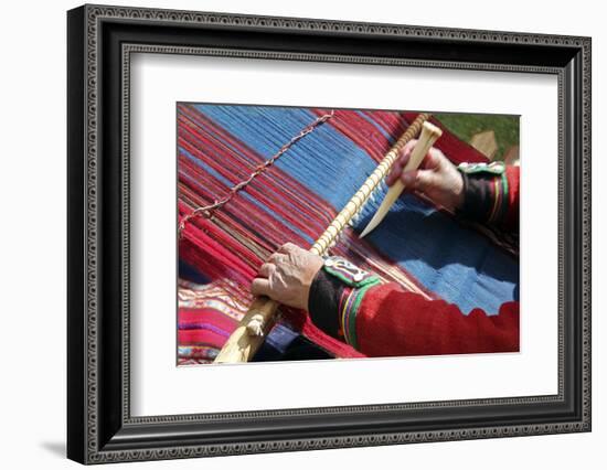 South America, Peru, Chinchero. Chinchero Cooperative weaver demonstrates using loom and tool.-Kymri Wilt-Framed Photographic Print