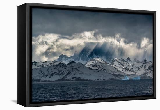 South Georgia Island. Opening in clouds and Virga reveal the mountainous and glaciated landscape.-Howie Garber-Framed Premier Image Canvas