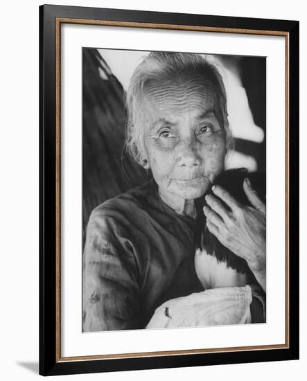 South Vietnamese Refugee Holding Small Child-Carl Mydans-Framed Photographic Print