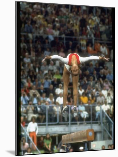 Soviet Gymnast Olga Korbut in Action on the Balance Beam at the Summer Olympics-John Dominis-Mounted Premium Photographic Print