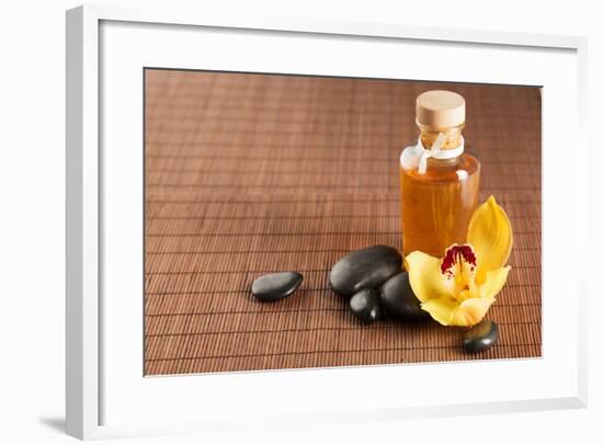 Spa, Health and Beauty Concept - Closeup of Essential Oil, Massage Stones and Orchid Flower-dolgachov-Framed Photographic Print