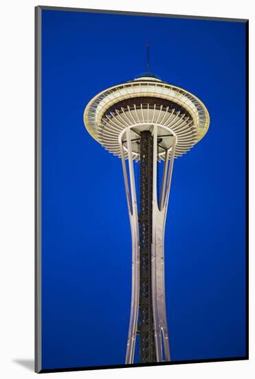 Space Needle in Seattle, Washington at dusk in deep blue sky; it is a major landmark and a symbo...-null-Mounted Photographic Print