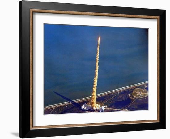 Space Shuttle Columbia on a Pillar of Exhaust as it Begins its Ten-Day Mission on Oct 22, 1992-null-Framed Photo