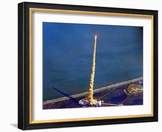 Space Shuttle Columbia on a Pillar of Exhaust as it Begins its Ten-Day Mission on Oct 22, 1992-null-Framed Photo