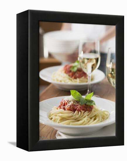 Spaghetti with Tomato Sauce and Glasses of White Wine on Table-null-Framed Premier Image Canvas