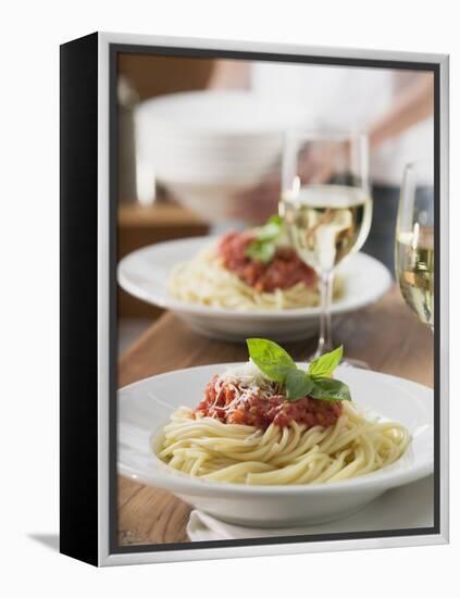 Spaghetti with Tomato Sauce and Glasses of White Wine on Table-null-Framed Premier Image Canvas