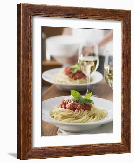 Spaghetti with Tomato Sauce and Glasses of White Wine on Table--Framed Photographic Print