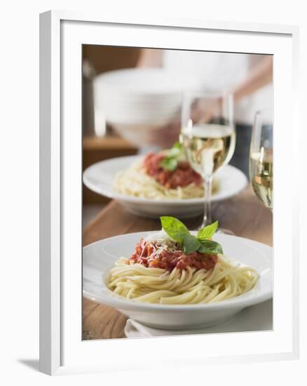 Spaghetti with Tomato Sauce and Glasses of White Wine on Table--Framed Photographic Print