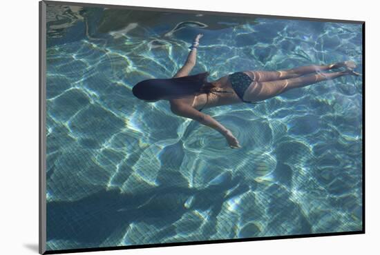 Spain, Ibiza, Cala Jondal. Girl Swimming at Maison De Bang Bang Villa-Katie Garrod-Mounted Photographic Print