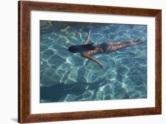 Spain, Ibiza, Cala Jondal. Girl Swimming at Maison De Bang Bang Villa-Katie Garrod-Framed Photographic Print