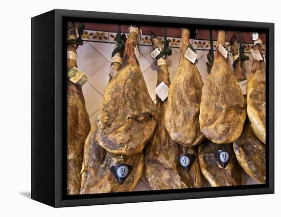Spanish Hams Hanging in a Restaurant Bodega, Seville, Andalusia, Spain, Europe-Guy Thouvenin-Framed Premier Image Canvas